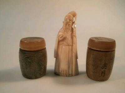 A pair of Chinese carved horn pots with covers and a small carved ivory figure of Sho Lao