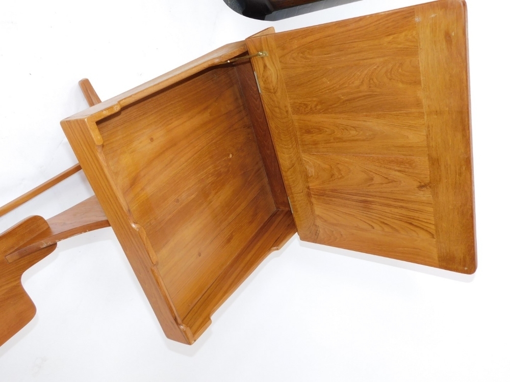 A 20thC one piece child's desk, with lift up lid raised above fixed