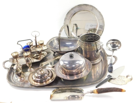 Various silver plated wares, a large oval tray with line and leaf border, 68cm wide, a cruet set, basket with swing handle, plain circular plate, lidded muffin dish, part cruet set, etc. (a quantity)