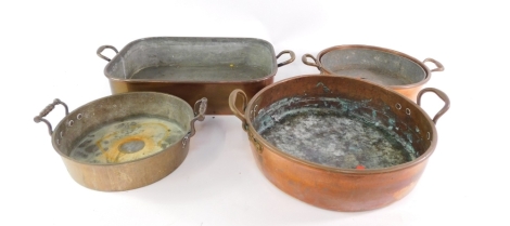 Various late 19th/early 20thC copper ware, fish kettle of oblong form with fixed handles, 56cm wide, and three circular skillets. (a quantity)