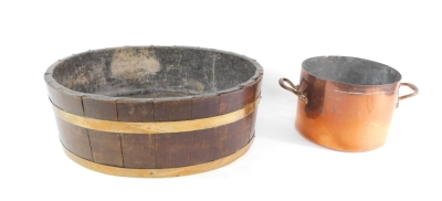 A late 19thC coopered oak wine cooler, of oval form, with brass banding and a lead lining, 23cm high, 69cm wide, 54cm deep, and a late Victorian copper pan of large proportion circular form, with fixed handles marked R3. (2)