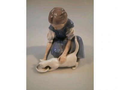 A Bing & Grondal porcelain figure of a young girl with a cat