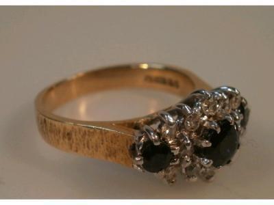 An 18ct sapphire and diamond set cluster ring London 1976<br