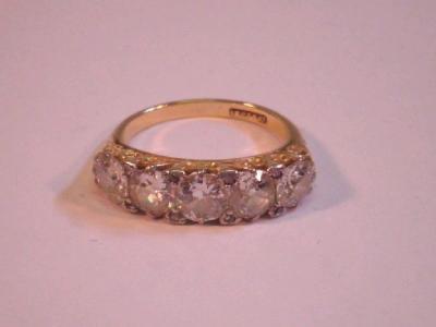 A five stone inline diamond set ring