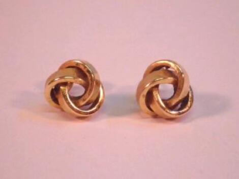 A pair of knot stud earrings stamped for 9ct