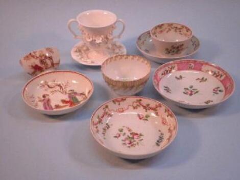 An 18thC English porcelain tea bowl and saucer decorated with oriental style figures