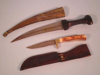 A hunting knife with an antler handle