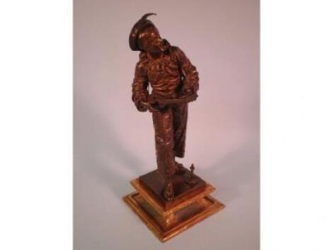 Eutrope Bouret (1833-1906) A patented bronze figure of a harlequin playing