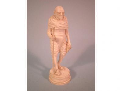 A continental carved ivory figure of Ghandi