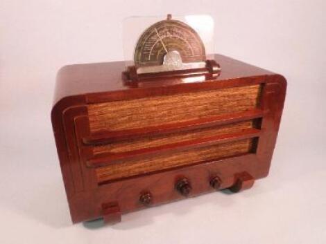 A 1937 Ultra radio in a walnut case with bakelite fittings
