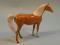 A Beswick figure of a bay horse with a white mane and tail