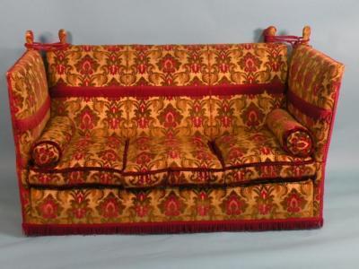 An early 20thC Knoll type sofa and two wing back armchairs