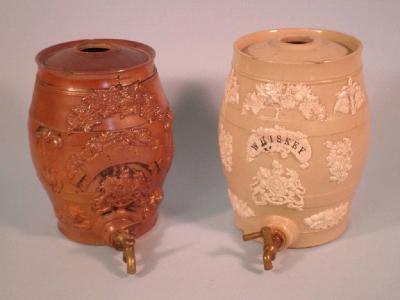 A 19thC brown stoneware barrel decorated in relief with lions