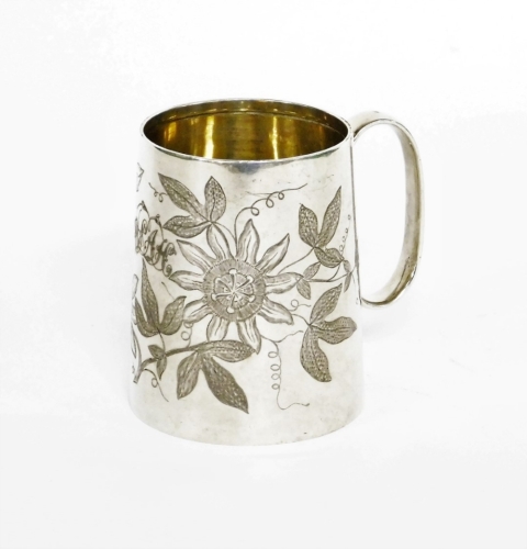 A Victorian silver child's tankard, heavily engine turned with flowers, bearing the initial WEAH, makers stamp JTH, London 1887, 6.5cm high, 3¼oz.