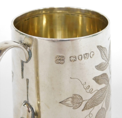 A Victorian silver child's tankard, heavily engine turned with flowers, bearing the initial WEAH, makers stamp JTH, London 1887, 6.5cm high, 3¼oz. - 2