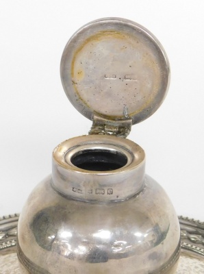 An Edward VII silver inkwell and stand, the bulbous shaped inkwell on a circular tray base, with fluted and ribbed borders, on three bun feet, makers stamp JD&S, Birmingham 1904 (AF), 7cm high, 13cm wide, 6½oz gross. - 2