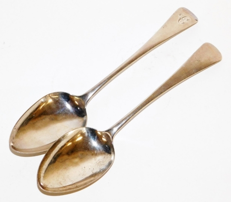 Two silver serving spoons, each of similar design, with Fiddle pattern end, one bearing the initial C, London 1779 and 1801, 3½oz. (2)