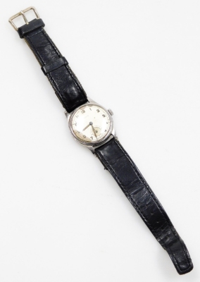 Two watches, to include a Smith's stainless steel cased gentleman's wristwatch, with silvered dial and date aperture on black leather strap, together with a continental silver fob watch, with hammered floral decoration and shield crest, on a white enamel - 2