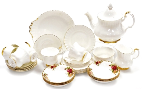 A Royal Albert Val D'or pattern part tea service, comprising teapot, six cups and saucers, six side plates, milk jug and sugar bowl, together with six Royal Albert Old Country Roses bowls. (1 tray)