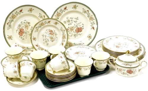 A Minton Jasmine pattern part tea and dinner service, comprising eight cups and saucers, eight side plates, tureen and cover, six bread plates and six dinner plates.