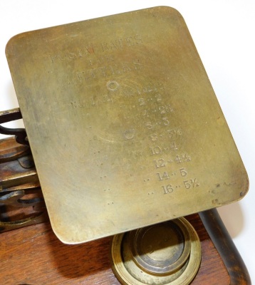 A set of early 20thC brass postal scales, on a wooden base with inscription postage rates for letters with an assortment of five weights on shaped mahogany base, 15cm high, 26cm wide, 14cm deep. - 2