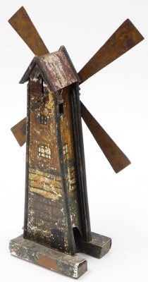 A late 19thC tin plate windmill, 43cm high. - 2