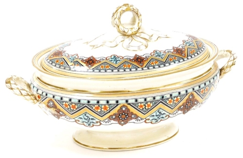 An early 20thC Royal Doulton tureen and cover, heavily decorated with flowers with blue and gilt banding, and knot tie handle, 21cm high, 39cm wide.
