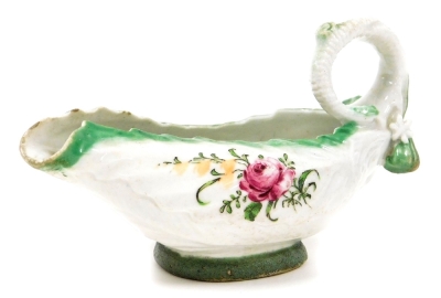 A mid-18thC Longton Hall soft paste porcelain sauce boat, cos moulded and polychrome decorated with green bordering and flowers, with a shaped loop handle, c.1755, 13cm wide. (AF)