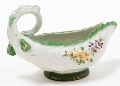 A mid-18thC Longton Hall soft paste porcelain sauce boat, cos moulded and polychrome decorated with green bordering and flowers, with a shaped loop handle, c.1755, 13cm wide. (AF) - 2