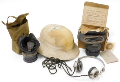 A group of military items, to include Erikson Beeston Notts, BBC a set of headphones, a cased gas mask and an explorers hat. (3)