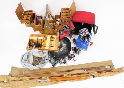 A group of fishing reels, boxes and rods, to include a Penn reels Penn Senator reel, landing net, two rods unmarked, fishing seats, various flies, hooks, etc. (a quantity)