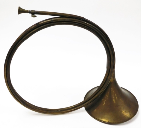 A brass hunting horn.