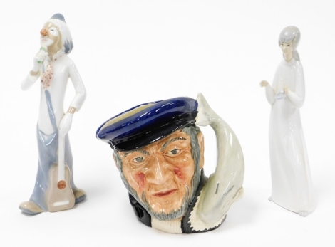 A group of collectors china, to include a Royal Doulton Captain Ahab character jug, 17cm high, a Casades Spanish clown figure and a Casades figure of a lady carrying candle. (3)