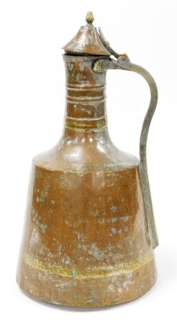 An Eastern copper storage vessel, with lift up handle on a brass support stamped Corum, 46cm high.