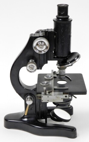 A Leitz microscope, with magnification table, numbered 349176, 32cm high, in fitted case.