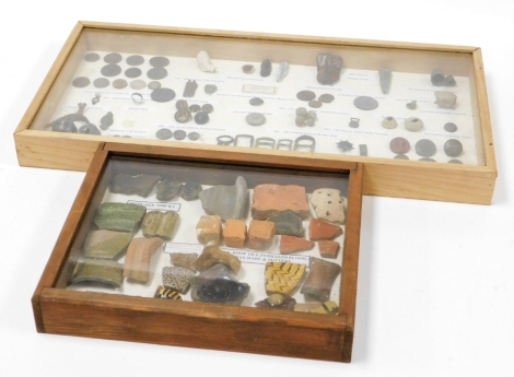 Two display cases, with contents of architectural finds, Military buttons, musket balls, etc. (2 cases)