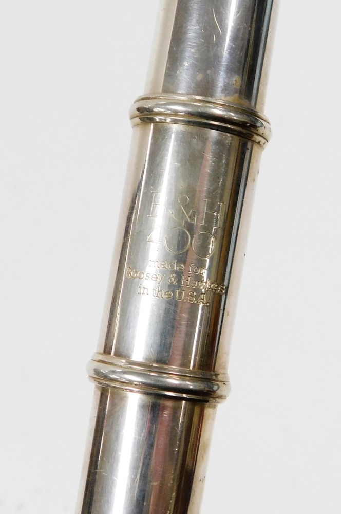 A Boosey & Hawkes flute, stamped 400, in fitted carry case.
