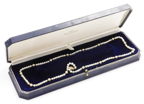 A freshwater pearl graduated single stand necklace, with a 9ct gold pierced design clasp, approximately 48cm long overall, 17.2g all in, boxed.