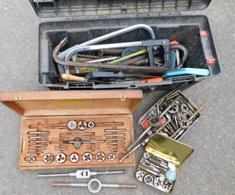 Various tap and die sets, and a plastic toolbox containing crowbar, saws, and other hand tools, etc.