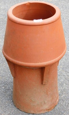 A Victorian terracotta chimney pot top, with circular capped design, 56cm high.
