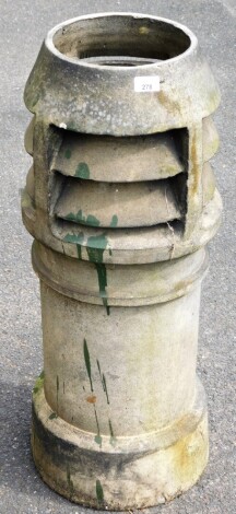 A Victorian stone chimney pot, with three layer turret top, 83cm high.