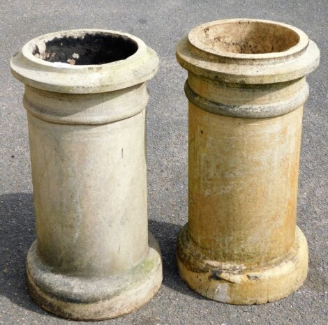 Two similar reconstituted stone chimney pots, 65cm high.