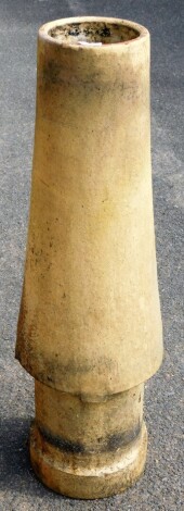 A fluted reconstituted stone chimney pot, of inward flared design, 98cm high.