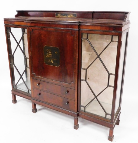 A walnut Japanned display cabinet, with cornice top with panel of figure amongst trees, above two astragal glazed doors with central square panel depicting Japanese scene, with two drawers on stepped legs, 140cm high, 150cm wide, 37cm deep.