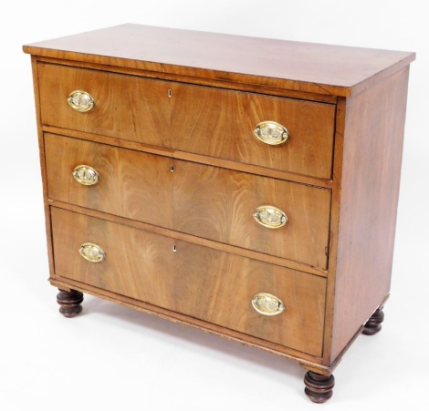 An early 19thC mahogany chest of drawers, with three long drawers with brass shell handles on turned bobbin feet, 84cm high, 93cm wide, 46cm deep.