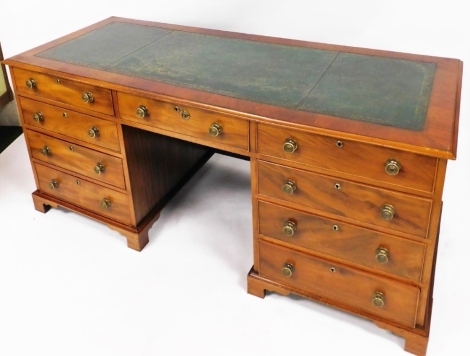 A mahogany pedestal desk, with four long drawers to each side and single drawer to centre with green inset leather top, 79cm high, 171cm wide, 70cm deep.