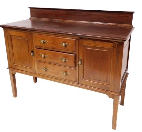 A late 19thC mahogany sideboard, with applied moulded top, above two cupboards and three drawers with brass handles on tapered legs, 120cm high, 136cm wide, 52cm deep.