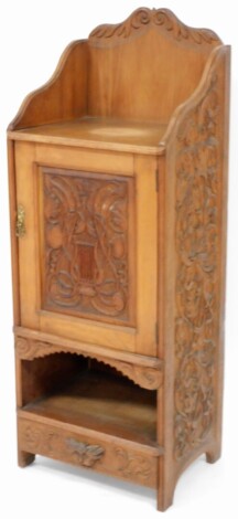 A late Victorian pot cupboard, the moulded top cornice above shelf with single door and cupboard door and drawer base, with half panelled sides, 122cm high, 46cm wide, 34cm deep.