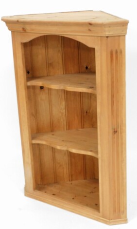 A pine hanging corner shelf, with moulded cornice above three shelves, 100cm high, 66cm wide, 41cm deep.