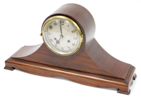 An early 20thC mahogany cased domed mantel clock, with silvered circular later painted dial, on mahogany balloon frame, 27cm high, 57cm wide, 15cm deep.